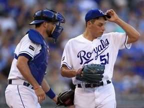 Kansas City Royals starting pitcher Jason Vargas (51) and catcher Drew Butera, left, talk after giving up a run during the first inning of a baseball game against the Cleveland Indians at Kauffman Stadium in Kansas City, Mo., Saturday, Aug. 19, 2017. (AP Photo/Orlin Wagner)