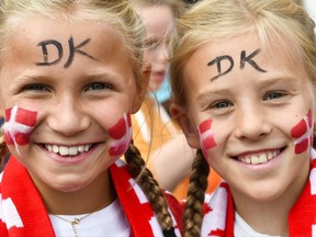 Two girls, supporter of Denmark's women national soccer team, smiles as they arrive in front of the stadium prior to the Women's Euro 2017 final soccer match between Netherlands and Denmark in Enschede, the Netherlands, Sunday, Aug. 6, 2017. (AP Photo/Patrick Post)