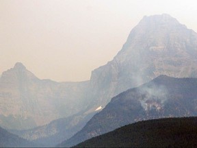 The Sprague Fire burns on Friday, Aug. 11, 2017, east of Lake McDonald in Glacier National Park, Mont.  (Greg Lindstrom/Flathead Beacon via AP)