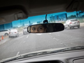 In this June 28, 2017 photo, Riodoce reporter Miriam Ramirez drives to her office in Culiacan, Sinaloa state, Mexico. After the killing of Riodoce co-founder Javier Valdez on May 15 and with an increase in killings of journalists nationwide, the newspaper's reporters are told by security experts that, among other things, it's important to change their routines, be more careful with social media and not leave colleagues alone in the office at night. (AP Photo/Enric Marti)
