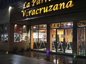 Tape protects the windows of a restaurant as residents prepare for the arrival of Hurricane Franklin, in the port city of Veracruz, Mexico, Wednesday, Aug. 9, 2017. As a tropical storm, Franklin made a relatively mild run across the Yucatan Peninsula on Monday night and Tuesday, but on Wednesday it strengthened to a hurricane over the Gulf of Mexico as it prepared to pound a mountainous region prone to flash floods and mudslides with heavy rains. (AP Photo/Felix Marquez)