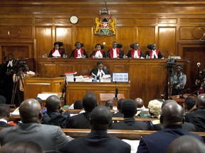 Kenyan Supreme Court judges, from left to right, Njoki Ndung'u, Jackton Ojwang, Deputy Chief Justice Philomela Mwilu, Chief Justice David Maraga, Smokin Wanjala and Isaac Lenaola preside over the second day of hearings of a petition challenging the presidential election result, at the Supreme Court in Nairobi, Kenya Tuesday, Aug. 29, 2017. Kenya's Supreme Court is hearing veteran opposition leader Raila Odinga's challenge to President Uhuru Kenyatta's re-election earlier this month. (AP Photo/Sayyid Azim)