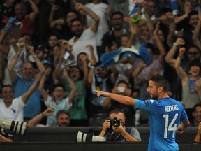Napoli's Dries Mertens celebrates after scoring during a Champions League playoff round, first leg soccer match between Napoli and Nice at San Paolo stadium in Naples, Wednesday, Aug. 16, 2017. (Cesare Abbate/ANSA Via AP)