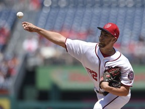 Washington Nationals starting pitcher A.J. Cole delivers a pitch during the first inning of the first baseball game of a split doubleheader against the San Francisco Giants, Sunday, Aug. 13, 2017, in Washington. (AP Photo/Nick Wass)