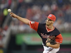 Washington Nationals starting pitcher A.J. Cole delivers a pitch during the first inning of a baseball game against the New York Mets, Friday, Aug. 25, 2017, in Washington. (AP Photo/Nick Wass)