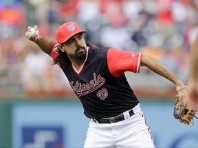 Washington Nationals third baseman Anthony Rendon throws to first base during the first inning of a baseball game against the New York Mets, Saturday, Aug. 26, 2017, in Washington. (AP Photo/Mark Tenally)