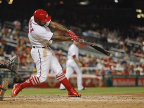 Washington Nationals Howie Kendrick hits a three-run RBI tripe against Miami Marlins pitcher Dustin McGowan during the sixth inning of a baseball game at Nationals Park, Monday, Aug. 28, 2017, in Washington. (AP Photo/Pablo Martinez Monsivais)