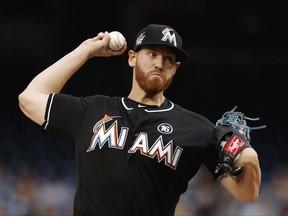 Miami Marlins starting pitcher Dan Straily (58) during the first inning of the team's baseball game against the Washington Nationals, Thursday, Aug. 10, 2017, in Washington. (AP Photo/Carolyn Kaster)