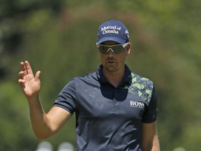 Henrik Stenson reacts to making a birdie putt on the first hole during the final round of the Wyndham Championship golf tournament in Greensboro, N.C., Sunday, Aug. 20, 2017. (AP Photo/Chuck Burton)