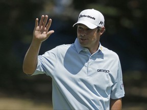 Johnson Wagner waves to the crowd after holing out his approach shot on the first hole for an eagle during the third round of the Wyndham Championship golf tournament in Greensboro, N.C., Saturday, Aug. 19, 2017. (AP Photo/Chuck Burton)