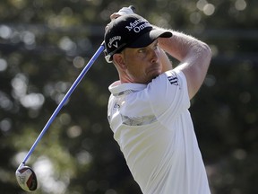 Henrik Stenson, of Sweden, watches his tee shot on the 18th hole during the second round of the Wyndham Championship golf tournament in Greensboro, N.C., Friday, Aug. 18, 2017. (AP Photo/Chuck Burton)