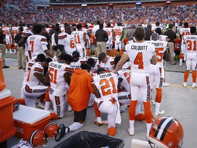A group of Cleveland Browns players kneel in a circle in protest during the national anthem prior to a pre-season game against the New York Giants on Aug. 21.