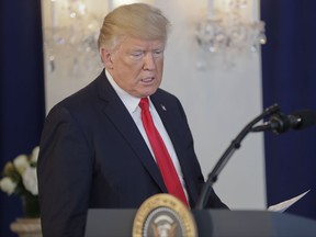 President Donald Trump walks up to the podium to speak regarding the on going situation in Charlottesville, Va., Saturday, Aug. 12, 2017 in Bedminister, N.J. (AP Photo/Pablo Martinez Monsivais)