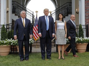 President Donald Trump with from left, Secretary of State Rex Tillerson, U.S. Ambassador to the United Nations Nikki Haley and national security adviser H.R. McMaster, arrive to speak to members of the media following their meeting at Trump National Golf Club in Bedminster, N.J., Friday, Aug. 11, 2017. (AP Photo/Pablo Martinez Monsivais)