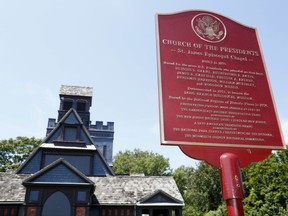 A marker explains some of the history of the Church of the Presidents in Long Branch, N.J., Thursday, Aug. 10, 2017. The church was named for the seven U.S. presidents that worshipped there, often while on vacation in New Jersey.  President Donald Trump is spending nearly three weeks in New Jersey at his golf club, but he's far from the first U.S. president to summer in the Garden State.(AP Photo/Seth Wenig)