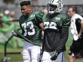 New York Jets' safeties Marcus Maye, right, and Jamal Adams walk together during a NFL football training camp in Florham Park, N.J., Monday, July 31, 2017. (AP Photo/Seth Wenig)