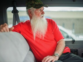 In this undated photo, James Green, co-leader of the Aggressive Christianity Missions Training Corps, waits in the parking lot of the Cibola County Magistrate Court in Grants, N.M. Four members of the New Mexico paramilitary religious sect rocked by child sexual abuse allegations were arrested while trying to flee the state in two vans full of children, authorities said Thursday, Aug. 24, 2017. (Adron Gardner/Gallup Independent via AP)