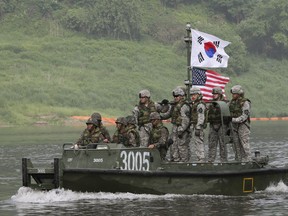 In this May 30, 2013 file photo, U.S. and South Korean Army soldiers cross Nam Han river during a joint military exercise between the U.S. and South Korea in Yeoncheon near the border with North Korea