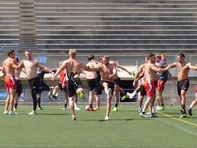 Members of the Toronto Wolfpack stretch at practice at Lamport Stadium in Toronto, Wednesday, Aug.30, 2017. THE CANADIAN PRESS/Neil Davidson