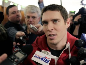 FILE - In this Jan. 2, 2012 file photo, New York Jets' Jim Leonhard talks to reporters in the Jets' locker room in Florham Park, N.J.  Leonhard is ready to call the shots for the first time as the Wisconsin Badgers' defensive coordinator. Leonhard was promoted from defensive backs coach in the offseason after Justin Wilcox left to take the head coaching job at California. The former NFL and Badgers safety says he tries to keep a calm presence on the field, so that if something goes wrong, players have confidence that mistakes will be fixed. The ninth-ranked Badgers open the season on Friday, Sept. 1, 2017 at home against Utah State.(AP Photo/Seth Wenig, File)