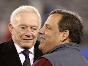 FILE - In this Nov. 23, 2014, file photo, Dallas Cowboys owner Jerry Jones, left, talks with New Jersey Gov. Chris Christie before an NFL football game against the New York Giants in East Rutherford, N.J. Christie is heading to Ohio to celebrate Jones' entry into the NFL Hall of Fame. Christie, a lifelong Cowboys fan despite most in New Jersey being fans of two of the Cowboys' biggest rivals: the New York Giants and Philadelphia Eagles. is scheduled to be in Canton, Ohio,  on Friday and Saturday to see Jones' induction.  (AP Photo/Kathy Willens, File)