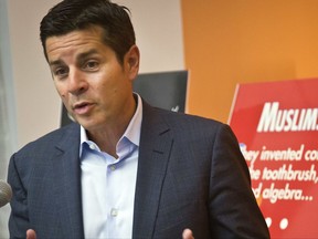 FILE - In this June 25, 2015, file photo, Muslim comedian Dean Obeidallah speaks at a news conference in New York. Obeidallah, a Muslim-American radio host, is accusing Andrew Anglin, the publisher of a notorious neo-Nazi website, of defaming him by falsely labeling him the "mastermind" of a deadly concert bombing in England, according to a federal lawsuit filed Wednesday, Aug. 16, 2017. (AP Photo/Bebeto Matthews, File)