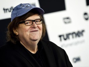 Michael Moore attends the Turner Network 2017 Upfront presentation at The Theater at Madison Square Garden in New York. Moore showed his patriotism by marching down the Avenue of the Americas with a drum and fife corps after making his Broadway debut. "I say this to the people who disagree with me, we're all Americans. We're all in the same boat, and we're going to sink or swim together. I prefer not to sink."