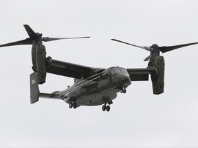 In this April 22, 2015 file photo, a Marine Corps MV-22 Osprey comes in for a landing at Miami International Airport before a presidential visit, in Miami.