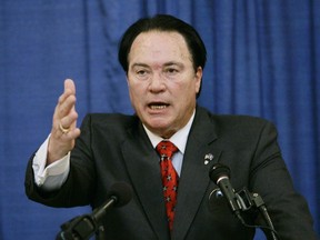 FILE - In this Wednesday, June 25, 2008 file photo, actor Sonny Landham gestures during a news conference to announce his candidacy for the U. S. Senate as the Libertarian Party challenger to Senate Minority Leader Mitch McConnell in Frankfort, Ky. Sonny Landham, the muscular action-movie actor who co-starred in "Predator" and "48 Hrs," has died. He was 76. Landham's sister Dawn Boehler said the actor died from congestive heart failure Thursday, Aug. 17, 2017 at a Lexington, Kentucky, hospital.  (AP Photo/Ed Reinke, File)