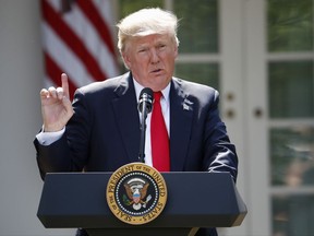 In this Thursday, June 1, photo, President Donald Trump announces the U.S. is pulling out of the Paris climate change accord in the Rose Garden of the White House in Washington.