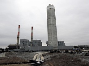 FILE - This Jan. 25, 2017 file photo shows the Gallatin Fossil Plant in Gallatin, Tenn. A federal judge on Friday, AUG. 4, 2017 ordered the nation's largest public utility to dig up its coal ash at Tennessee Valley Authority's Gallatin Fossil Plant and move it to a lined waste site where it doesn't risk further polluting the Cumberland River.(AP Photo/Mark Humphrey, File)