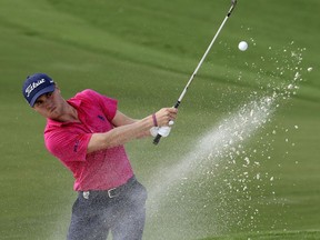 File-This Aug. 13, 2017, file photo shows Justin Thomas hitting from the bunker on the 18th hole during the final round of the PGA Championship golf tournament at the Quail Hollow Club in Charlotte, N.C. The FedEx Cup isn't the only trophy at stake over the next five weeks. One trophy is known for its $10 million prize, with $9 million in cash. The other is about respect and honor from the other players. (AP Photo/John Bazemore, File)