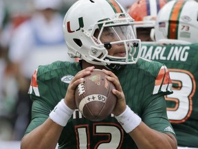 File-This Oct. 24, 2015, file photo shows Miami quarterback Malik Rosier (12) looking for an open receiver  during the first half of an NCAA College football game Miami Gardens, Fla. Rosier was announced Tuesday as No. 18 Miami's new starting quarterback, winning the right to take over for record-setting three-year starter Brad Kaaya under center for the Hurricanes. He beat Evan Shirreffs and N'Kosi Perry for the job, and threw for team-highs of 441 yards and five touchdowns in Miami's two camp scrimmages.(AP Photo/Wilfredo Lee, File)