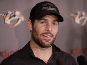 FILE - In this Sept. 22, 2016, file photo, Nashville Predators forward and captain Mike Fisher talks to reporters on the first day of NHL hockey training camp, in Nashville, Tenn. Mike Fisher has announced his retirement, a move that means the defending Stanley Cup finalists must select a new captain. Fisher, 37, said in a letter to Predators fans that "this is the hardest decision that I've ever had to make, but I know I've made the right one."(AP Photo/Mark Humphrey, File)