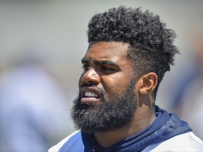 FILE - This is a July 25, 2017, file photo showing Dallas Cowboys running back Ezekiel Elliott during NFL football training camp in Oxnard, Calif. Elliott has been suspended for six games under the NFL's personal conduct policy following the league's yearlong investigation into the running back's domestic violence case out of Ohio. The 2016 NFL rushing leader was suspended despite prosecutors in Columbus, Ohio, deciding more than a year ago not to pursue the case involving Elliott's girlfriend at the time in the same city where Elliott starred for Ohio State. The league said Friday, Aug. 11, 2017, there was "substantial and persuasive evidence" that Elliott had physical confrontations last summer with his ex-girlfriend, Tiffany Thompson. (AP Photo/Gus Ruelas, File)