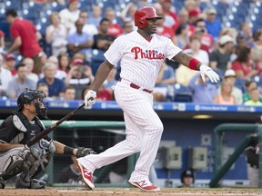 FILE - In this July 21, 2016, file photo, Philadelphia Phillies' Ryan Howard bats during the team's baseball game against the Miami Marlins in Philadelphia. The Colorado Rockies have agreed to a minor league contract with  Howard, who will report to Triple-A Albuquerque. Ryan, 37, hasn't played in the majors this season but could be a September call-up if he shows some power at the plate. He would be eligible for the postseason roster if the Rockies qualify for the playoffs. (AP Photo/Chris Szagola, File)