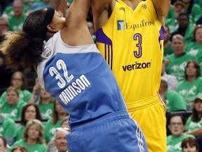 FILE - In this Oct. 20, 2016, file photo, Los Angeles Sparks' Candace Parker, right, attempts to shoot over Minnesota Lynx's Rebekkah Brunson in the first quarter during Game 5 of the WNBA basketball finals. The developers held motion capture sessions with WNBA players, including veteran Candace Parker, to be featured in a video game for the first time this fall.  (AP Photo/Jim Mone, File)