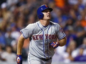 FILE - In this Aug. 1, 2017, file photo, New York Mets' Jay Bruce watches his solo home run off Colorado Rockies relief pitcher Chris Rusin during a baseball game in Denver. A person familiar with the deal says the Cleveland Indians have agreed to acquire outfielder Bruce from the Mets. The person spoke to The Associated Press on condition of anonymity Wednesday, Aug. 9, because the trade had not been announced. (AP Photo/David Zalubowski, File)
