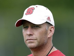 In this photo taken Saturday, July 29, 2017, North Carolina State coach Dave Doeren looks on during the team's NCAA college football practice in Raleigh, N.C. Doeren has dismissed two players from the team and suspended three others for violating athletics department and team rules tied to marijuana and alcohol during a campus party last month. The team announced those dismissals and suspensions Tuesday, Aug. 22, 2017, while the school issued a news release saying the violations were discovered as university police investigated allegations of sexual assault. (AP Photo/Gerry Broome, File)