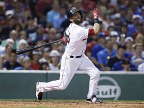 FILE - In this July 18, 2017, file photo, Boston Red Sox's Dustin Pedroia bats during the team's baseball game against the Toronto Blue Jays at Fenway Park in Boston. Pedroia could be headed to the disabled list for the third time this season. Pedroia went 0 for 4 as a designated hitter Wednesday, Aug. 9, at Tampa Bay in his first game since July 28. Pedroia's left knee was too inflamed for him to play Friday night for the AL East leaders at Yankee Stadium, and Red Sox manager John Farrell said a return to the DL was possible. (AP Photo/Charles Krupa, File)