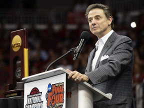 FILE - In this April 10, 2013, file photo, Louisville men's basketball coach Rick Pitino speaks to fans during a celebration in Louisville, Ky.  Louisville says the NCAA "abused" its authority when it disciplined the school for a sex scandal that could result in the loss of its 2013 national basketball championship. The school also says in a 68-page appeal released Friday, Aug. 11, 2017, that the governing body imposed "draconian" penalties and ignored the school's self-imposed discipline. Louisville banned itself from the 2016 postseason after its investigation uncovered violations. The Hall of Fame coach called the NCAA penalties "unjust and over the top in its severity" when they were announced on June 15. (AP Photo/Timothy D. Easley, File)