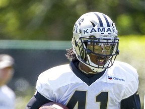 FILE  - In this Thursday, May 25, 2017 file photo, New Orleans Saints running back Alvin Kamara (41) carries the ball during an NFL football practice in Metairie, La. Why rookie Saints running back Alvin Kamara never emerged as a premier college player at Alabama or Tennessee remains unclear to coach Sean Payton. All Payton knows is that Kamara has continued during training camp to show promise as far as fulfilling the vision the Saints have for the third round pick. (AP Photo/Derick E. Hingle, File)