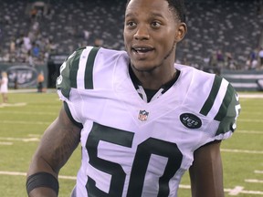 FILE - In this Thursday, Aug. 11, 2016 file photo, New York Jets outside linebacker Darron Lee (50) walks on the field after playing in an NFL football game against the Jacksonville Jaguars in East Rutherford, N.J. Darron Lee took the field at times last season and all kinds of thoughts would rush through his head.The New York Jets linebacker was thinking too much as a rookie, and it was affecting his natural playmaking abilities. Entering his second NFL season, Lee can already tell things are different for him. (AP Photo/Bill Kostroun, File)