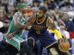 FILE - In this Nov. 3, 2016, file photo, Cleveland Cavaliers' Kyrie Irving, right, looks to drive against Boston Celtics' Isaiah Thomas during the first half of an NBA basketball game in Cleveland. Irving, who asked Cavaliers owner Dan Gilbert to trade him earlier this summer, could be on his way to Boston as the Cavaliers are in serious negotiations with the Celtics about swapping him for point guard Thomas. Since Irving made his stunning request, the defending Eastern Conference champions have been looking for a trade partner. They may have found the perfect one and could be nearing a deal with the Celtics, said the person who spoke Tuesday night, Aug. 22, 2017, to The Associated Press on condition of anonymity because of the sensitivity of the talks. (AP Photo/Ron Schwane, File)