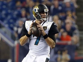 File-This Aug. 10, 2017, file photo shows Jacksonville Jaguars quarterback Chad Henne looking for a receiver in the first half of an NFL preseason football game against the New England Patriots, in Foxborough, Mass.  The Jaguars name a starting quarterback for their preseason game against Carolina, and all indications are it will be Henne. (AP Photo/Mary Schwalm, File)