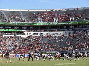 In this Oct. 29, 2016 file photo, Louisville lines up for a play against Virginia during an NCAA college football game in Charlottesville, Va.