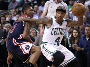 File-This may 10, 2017, file photo shows Boston Celtics guard Isaiah Thomas (4) driving to the basket during the first quarter of a second-round NBA playoff series basketball game in Boston.  Following the biggest slight of his NBA career, Thomas will have to prove his worth again. All eyes will be watching how he rebounds after Tuesday's blockbuster trade. The Celtics sent the two-time All-Star packing from a franchise and city that he'd embraced with every ounce of his 5-foot-9 frame. He's now bound for Cleveland in exchange for what the Celtics believe is a bigger star, and better point guard, in Kyrie Irving. (AP Photo/Charles Krupa, File)