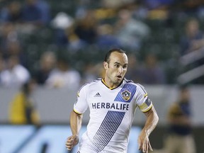 FILE - In this Wednesday, Aug. 27, 2014 file photo, Los Angeles Galaxy's Landon Donovan controls the ball against D.C. United during an MLS soccer match in Carson, Calif. Of all the rivalries in Major League Soccer, the California Clasico is among the most spirited. Just ask Landon Donovan, who played for both sides during his career. (AP Photo/Danny Moloshok, File)