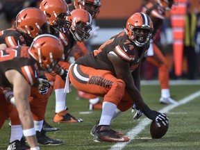 In this Sunday, Nov. 27, 2016 file photo, Cleveland Browns center Cameron Erving (74) prepares to snap the ball in the first half of an NFL football game against the New York Giants in Cleveland. The Browns have traded offensive lineman Cam Erving, a former first-round pick, to the Kansas City Chiefs, Wednesday, Aug. 30, 2017. (AP Photo/David Richard, File)