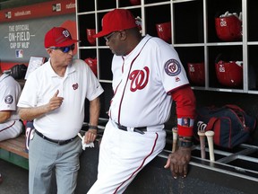 FILE - In this July 6, 2016, file photo, Washington Nationals owner Mark Lerner, left, talks with manager Dusty Baker in the dugout before the team's baseball game against the Milwaukee Brewers at Nationals Park in Washington. Lerner said Thursday night, Aug. 17, 2017, in a letter to a Washington Post columnist that he had cancer and had his left leg amputated. (AP Photo/Alex Brandon, File)